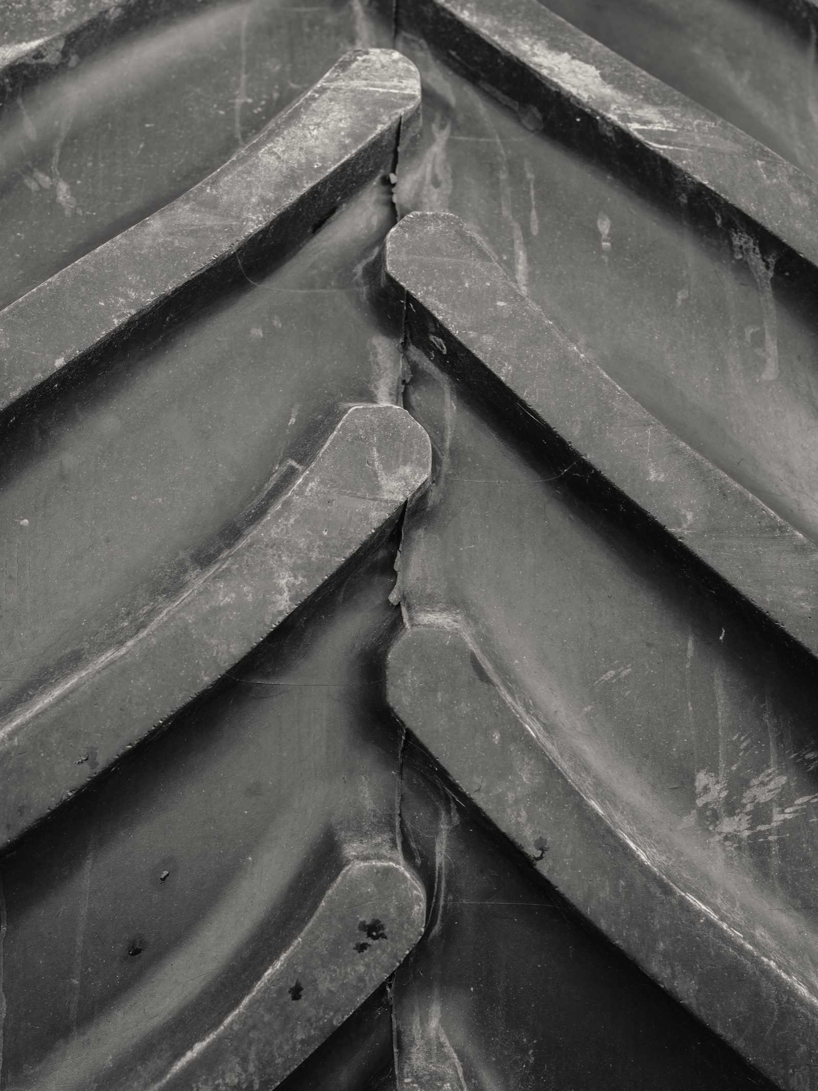 Close view of deep lugs on a large tractor tire